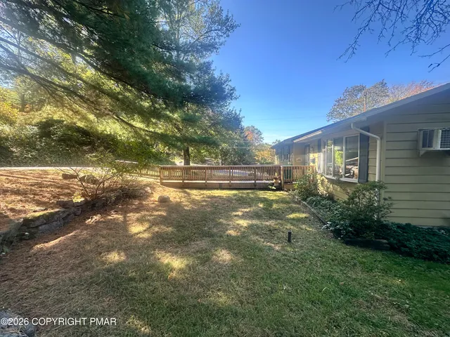 a view of backyard with green space