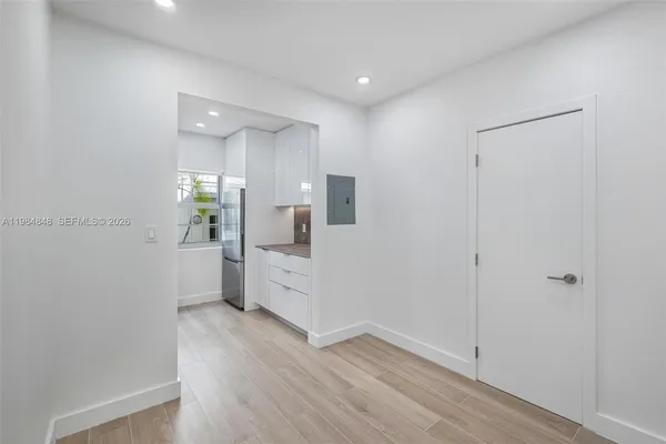 a view of a kitchen cabinets and wooden floor