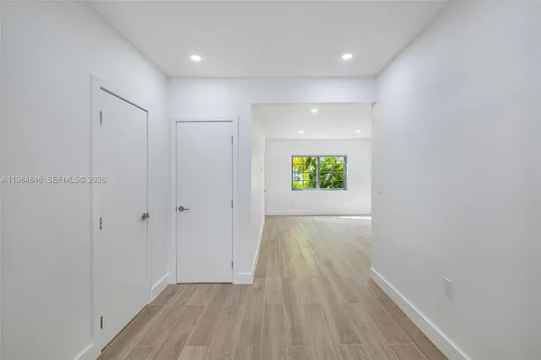 a view of an empty room and window