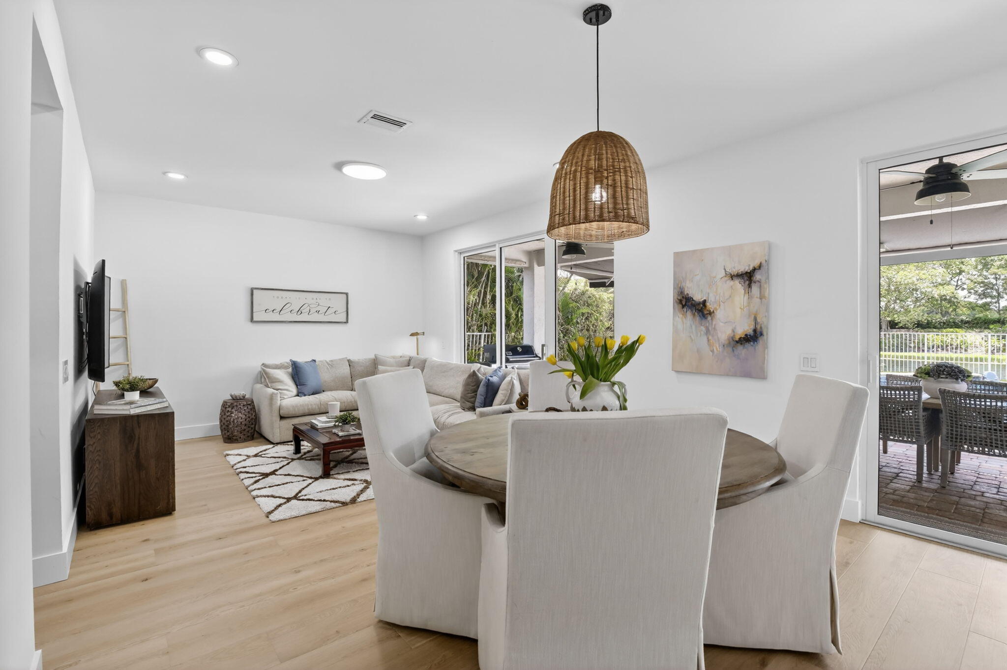 4299 Laurel Ridge Circle Weston, FL 33331 - Photo 37 of 103 a living room with furniture and a chandelier
