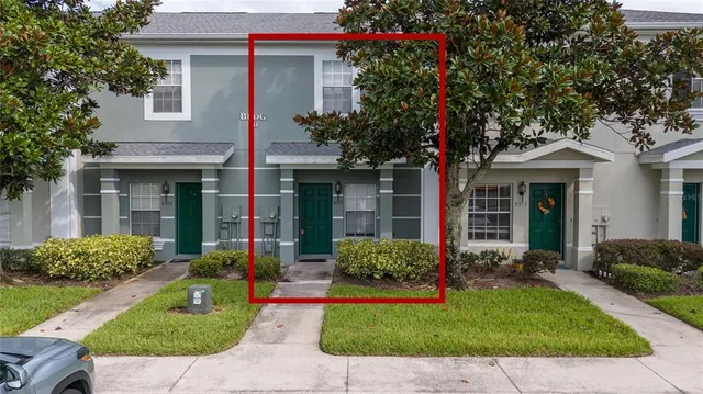 a front view of a house with a yard and porch