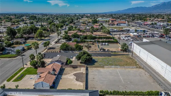 an aerial view of a residential houses with city view