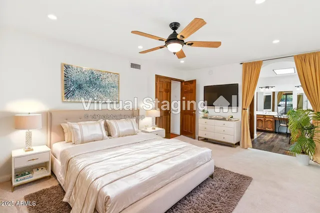 a view of a livingroom with a ceiling fan and window
