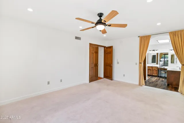 a spacious bathroom with a tub and a sink