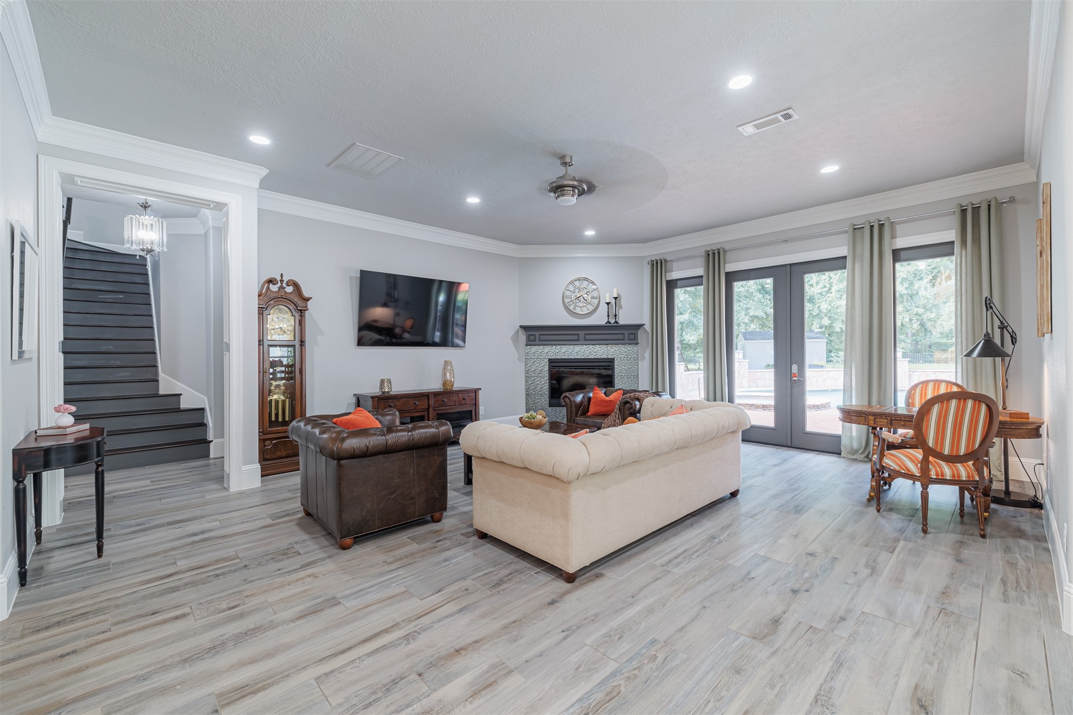 16636 Stonecrest Drive Conroe, TX 77302 - Photo 11 of 40 Open, airy, and inviting, the living room beckons you to unwind, enjoy the serene backyard views, and savor quiet moments or joyful celebrations.