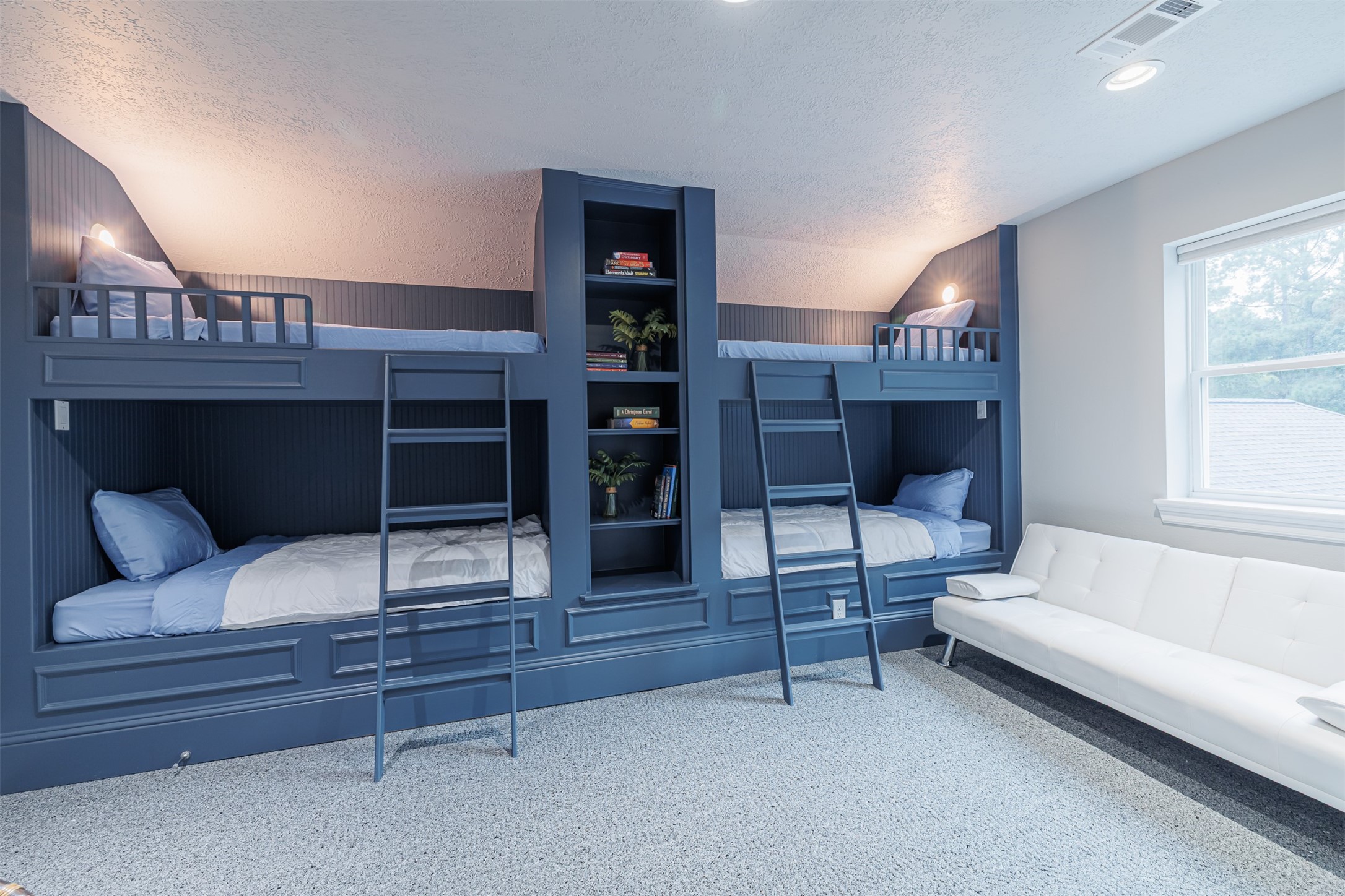 16636 Stonecrest Drive Conroe, TX 77302 - Photo 21 of 40 Bedroom 5 – Bunk Room:
Designed with imagination and comfort in mind, this charming bunk room features two built-in sets of beds—perfect for sleepovers, grandkids, or a dreamy reading nook. Thoughtful lighting and custom shelving make this a cozy hideaway everyone will love.