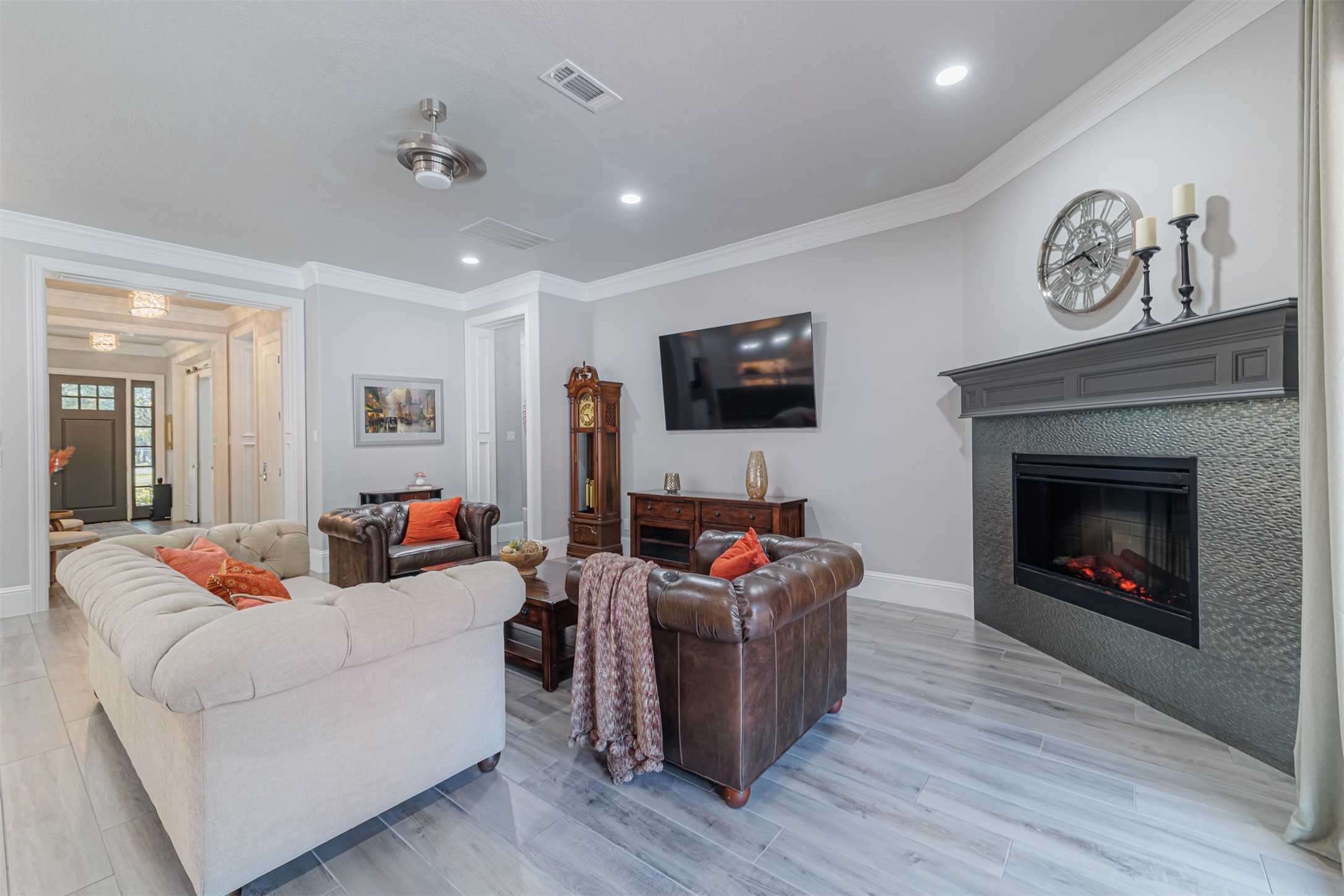 16636 Stonecrest Drive Conroe, TX 77302 - Photo 27 of 40 Every angle of this thoughtfully designed living space exudes comfort, enhanced by the warmth of the fireplace and the understated elegance of refined finishes.