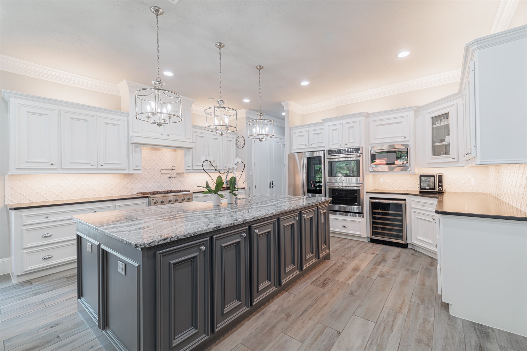 16636 Stonecrest Drive Conroe, TX 77302 - Photo 30 of 40 This is where memories are made—surrounded by the aroma of home-cooked meals, soft conversation over wine, and the comforting hum of life unfolding around a grand gathering island.