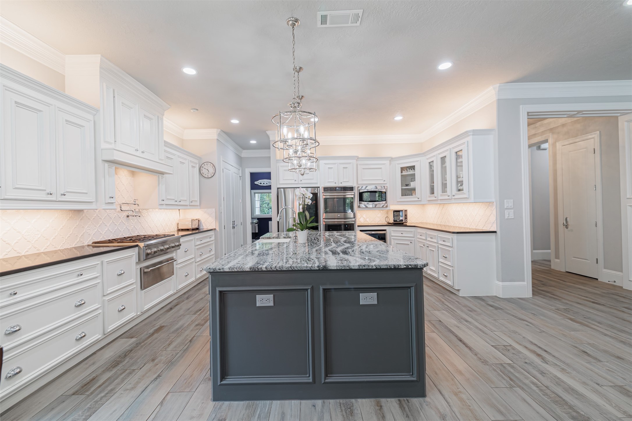 16636 Stonecrest Drive Conroe, TX 77302 - Photo 31 of 40 Step into a kitchen that inspires—with space to create, room to breathe, and a design that makes even the everyday moments feel extraordinary.