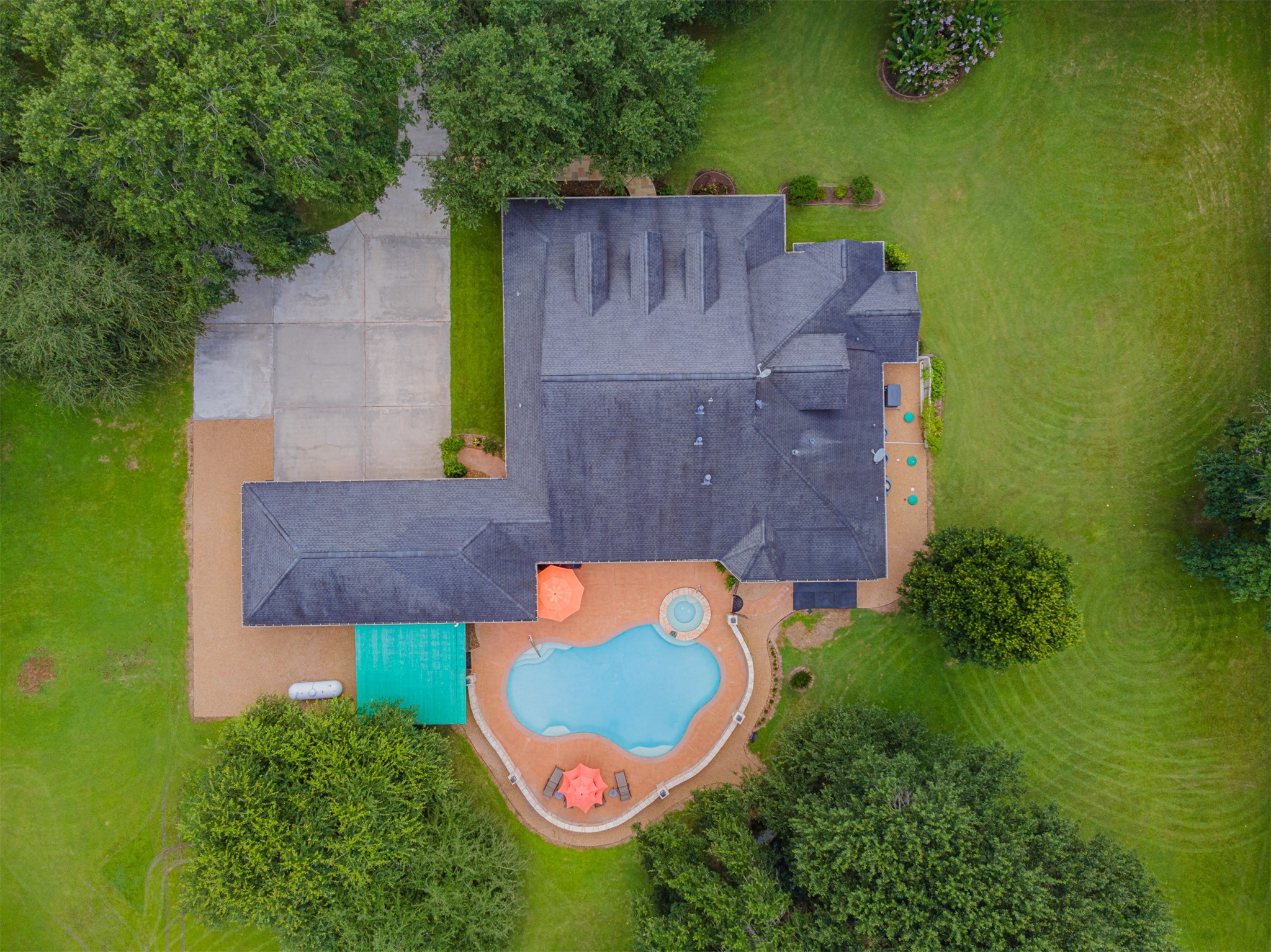 16636 Stonecrest Drive Conroe, TX 77302 - Photo 34 of 40 Every curve of the backyard pool and every corner of the home whisper, “Come live your best life.”