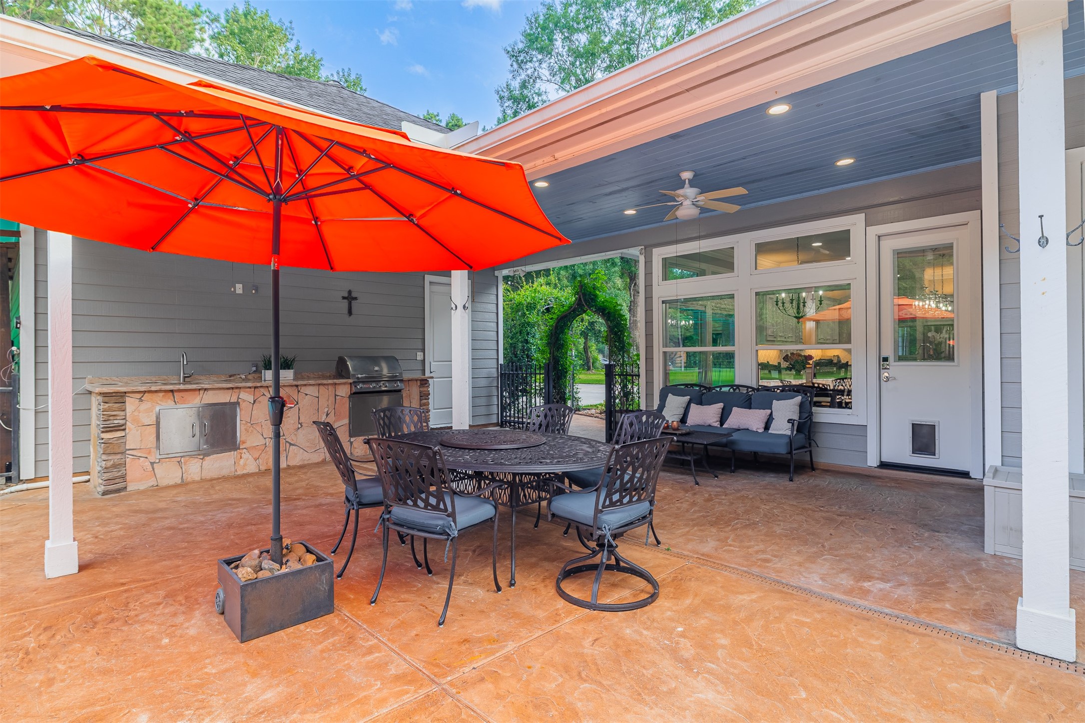 16636 Stonecrest Drive Conroe, TX 77302 - Photo 37 of 40 Just steps from the main kitchen and tucked beside the garage, this outdoor kitchen is the heart of effortless entertaining. Fire up the built-in grill, prep your feast on the stone countertop, and serve it hot to guests gathered around the shaded dining table. With everything in reach and the perfect flow from indoors to out, this space was made for weekend barbecues, birthday parties, and spontaneous celebrations under the open sky.