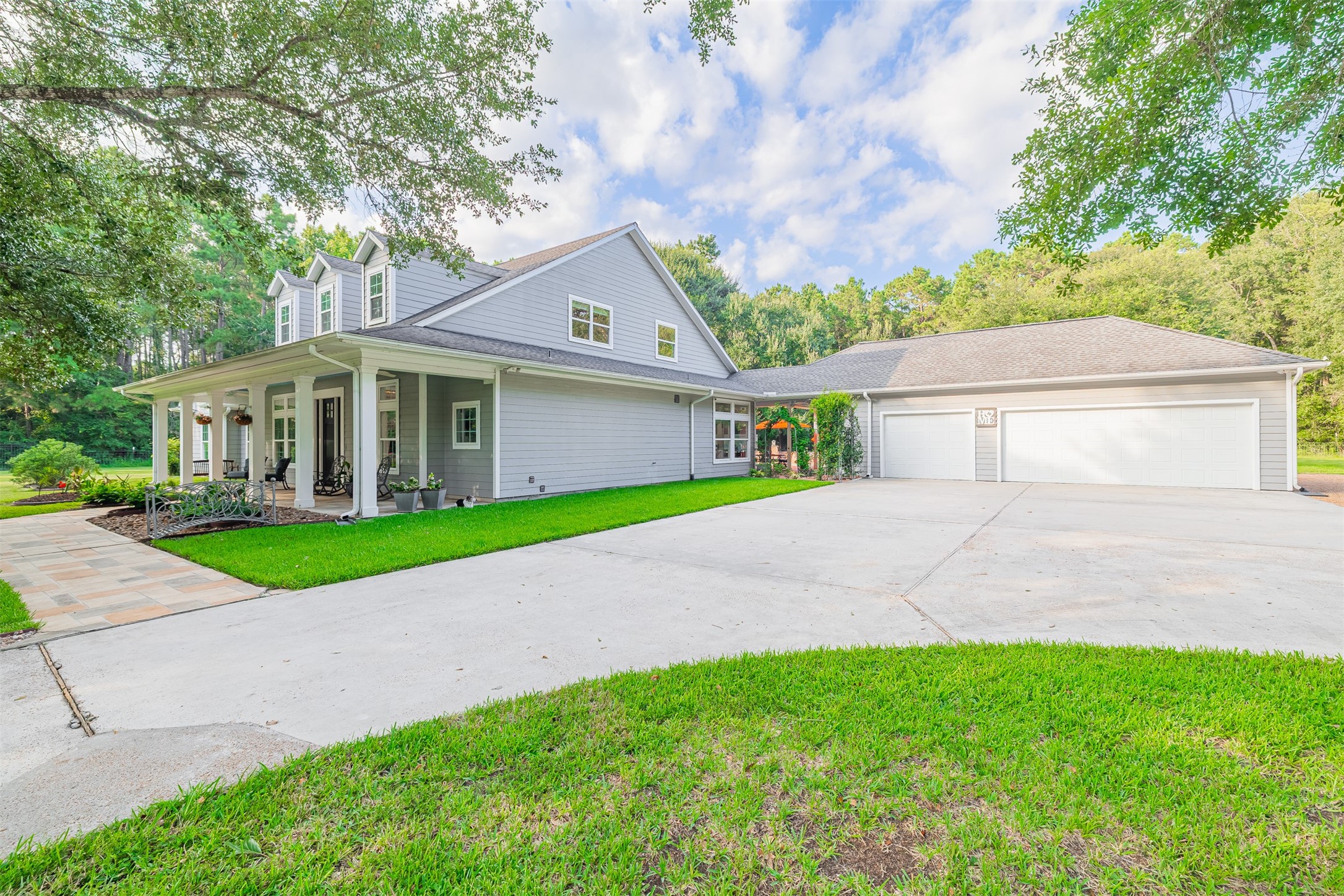 16636 Stonecrest Drive Conroe, TX 77302 - Photo 40 of 40 As guests leave down the long, tree-lined drive, this is the final view etched in their memory — a home that feels like a retreat. The spacious driveway offers a graceful exit, but part of you won’t want to leave. This isn’t just a driveway; it’s a pathway that brings people home — and reminds them they’re always welcome back.