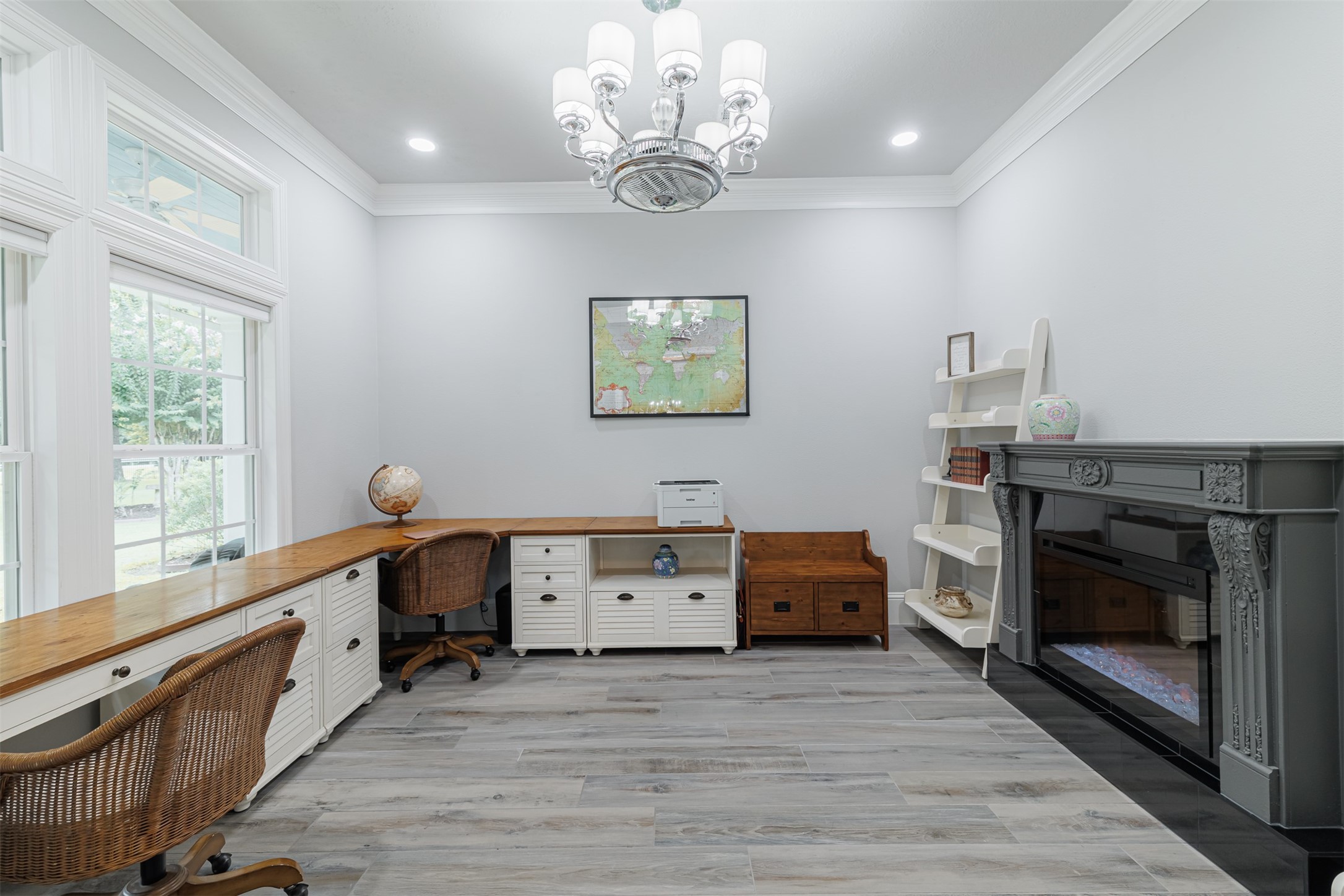 16636 Stonecrest Drive Conroe, TX 77302 - Photo 6 of 40 Envision productive days in your spacious, sunlit study—warmed by a charming fireplace, brightened by elegant lighting, and enhanced by serene views of the tranquil outdoors.