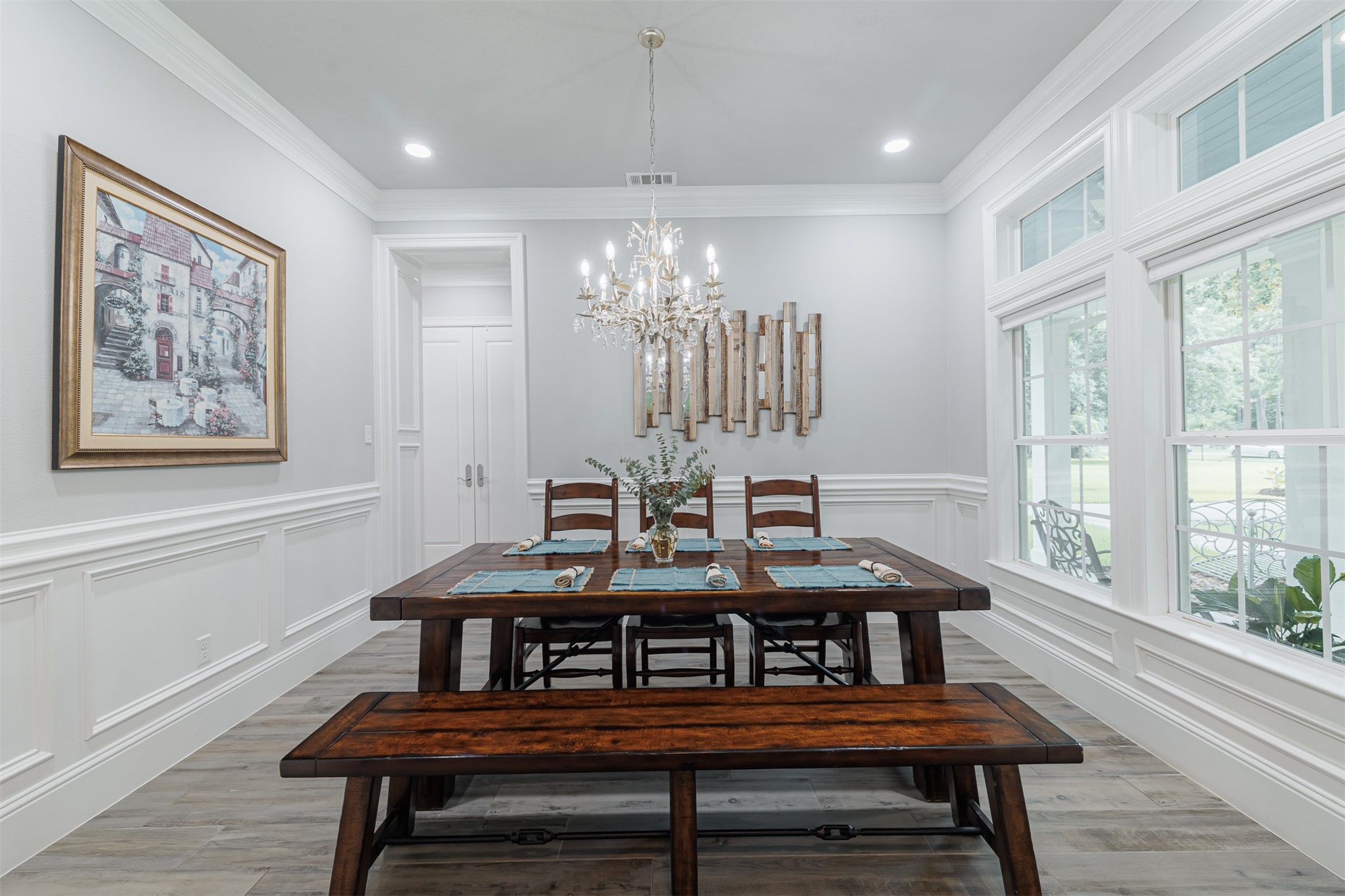 16636 Stonecrest Drive Conroe, TX 77302 - Photo 7 of 40 A refined space designed for memorable dinners and heartfelt conversations, where exquisite details like the chandelier and custom millwork perfectly frame your special gatherings.
