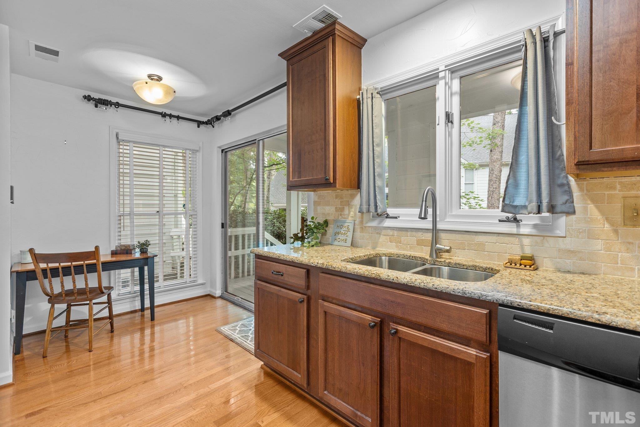 3903 Carnegie Lane Raleigh, NC 27612 - Photo 15 of 36 a kitchen with a sink and cabinets