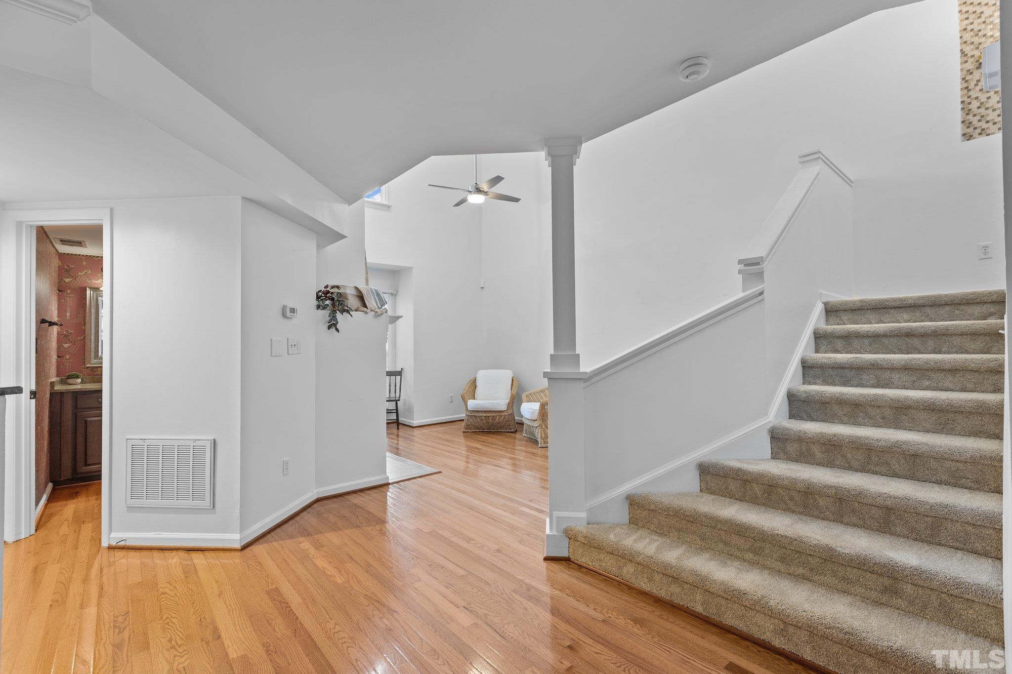 3903 Carnegie Lane Raleigh, NC 27612 - Photo 5 of 36 a view of entryway and hall with wooden floor