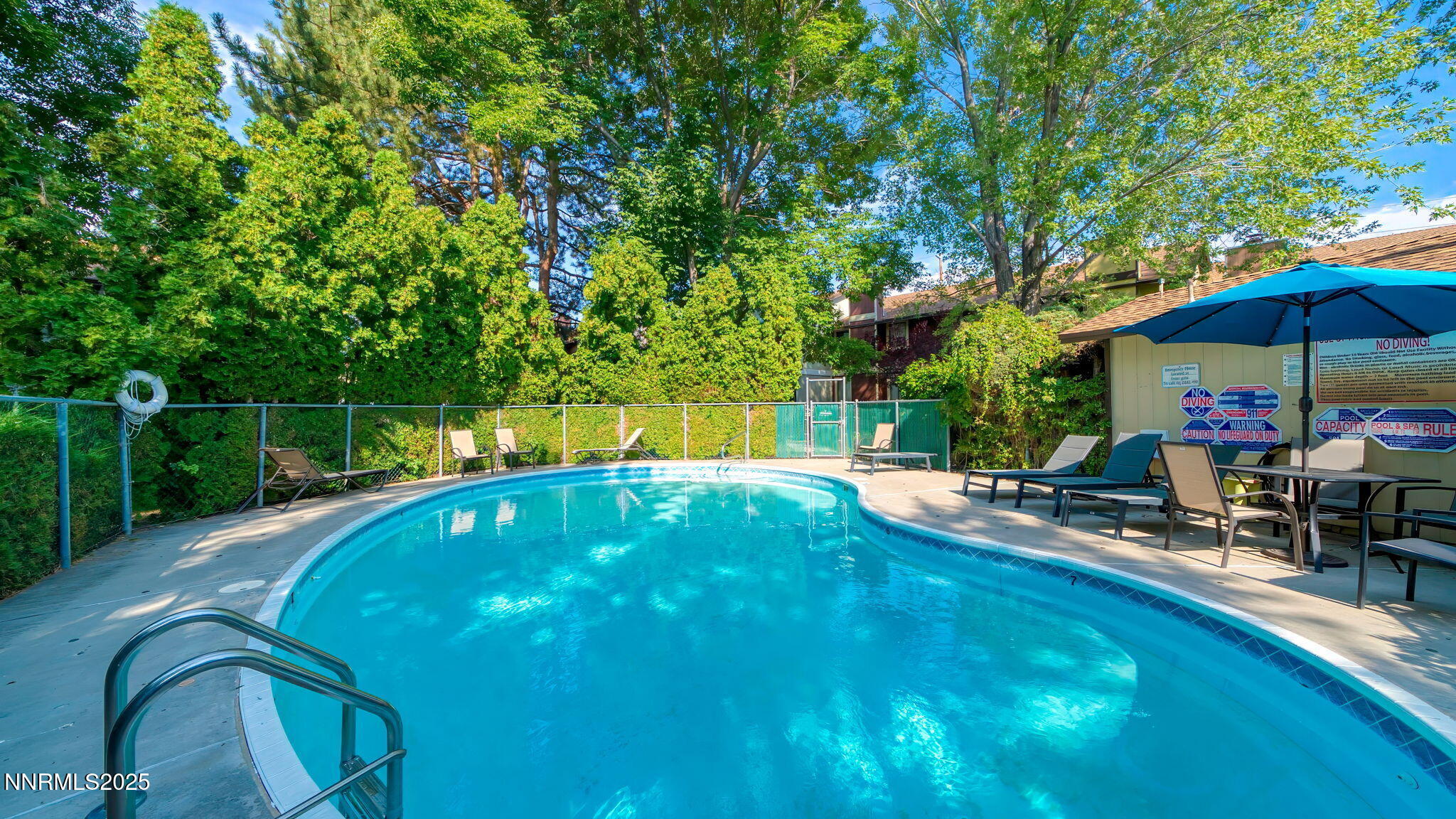 1515 Foster Drive Reno, NV 89509 - Photo 14 of 50 a view of a swimming pool with a patio and a backyard