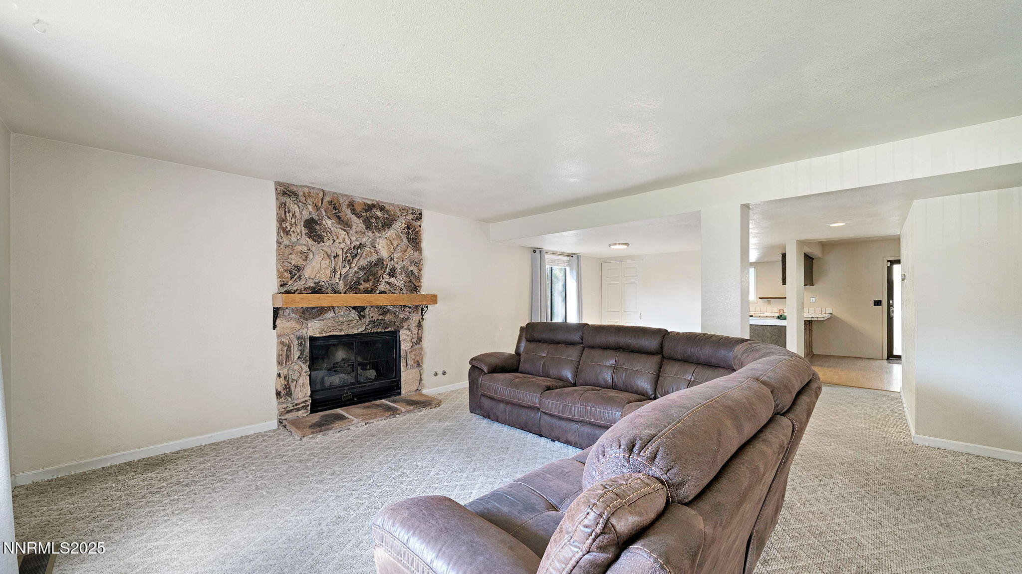 1515 Foster Drive Reno, NV 89509 - Photo 20 of 50 a living room with furniture and a fireplace