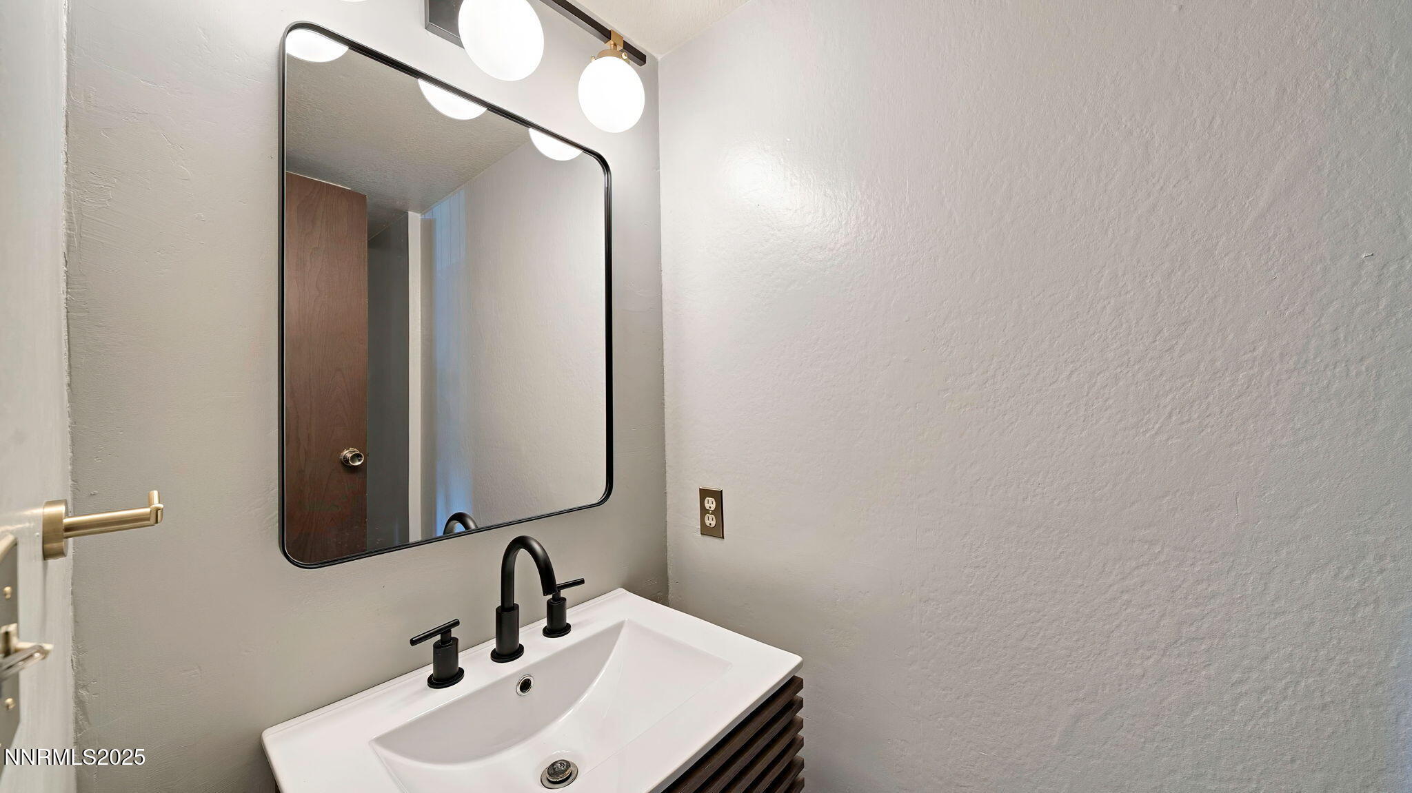 1515 Foster Drive Reno, NV 89509 - Photo 22 of 50 a bathroom with a sink and a mirror