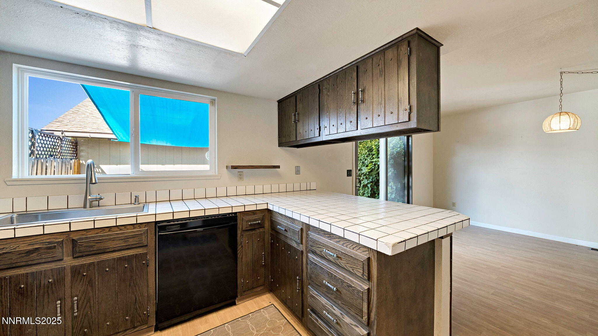 1515 Foster Drive Reno, NV 89509 - Photo 28 of 50 a kitchen with a sink cabinets and wooden floor