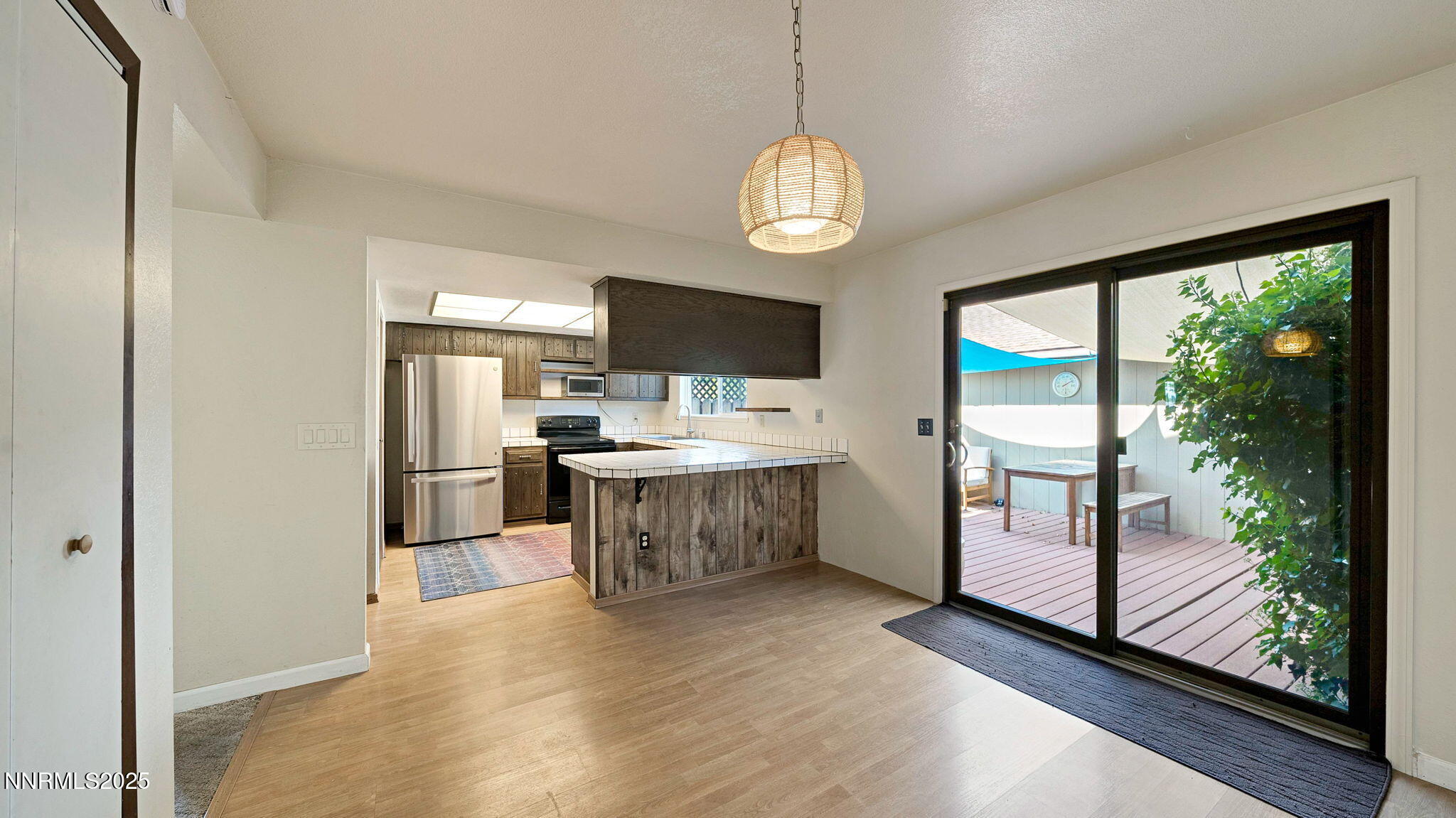 1515 Foster Drive Reno, NV 89509 - Photo 3 of 50 a view of kitchen with sink microwave refrigerator and dining table chair