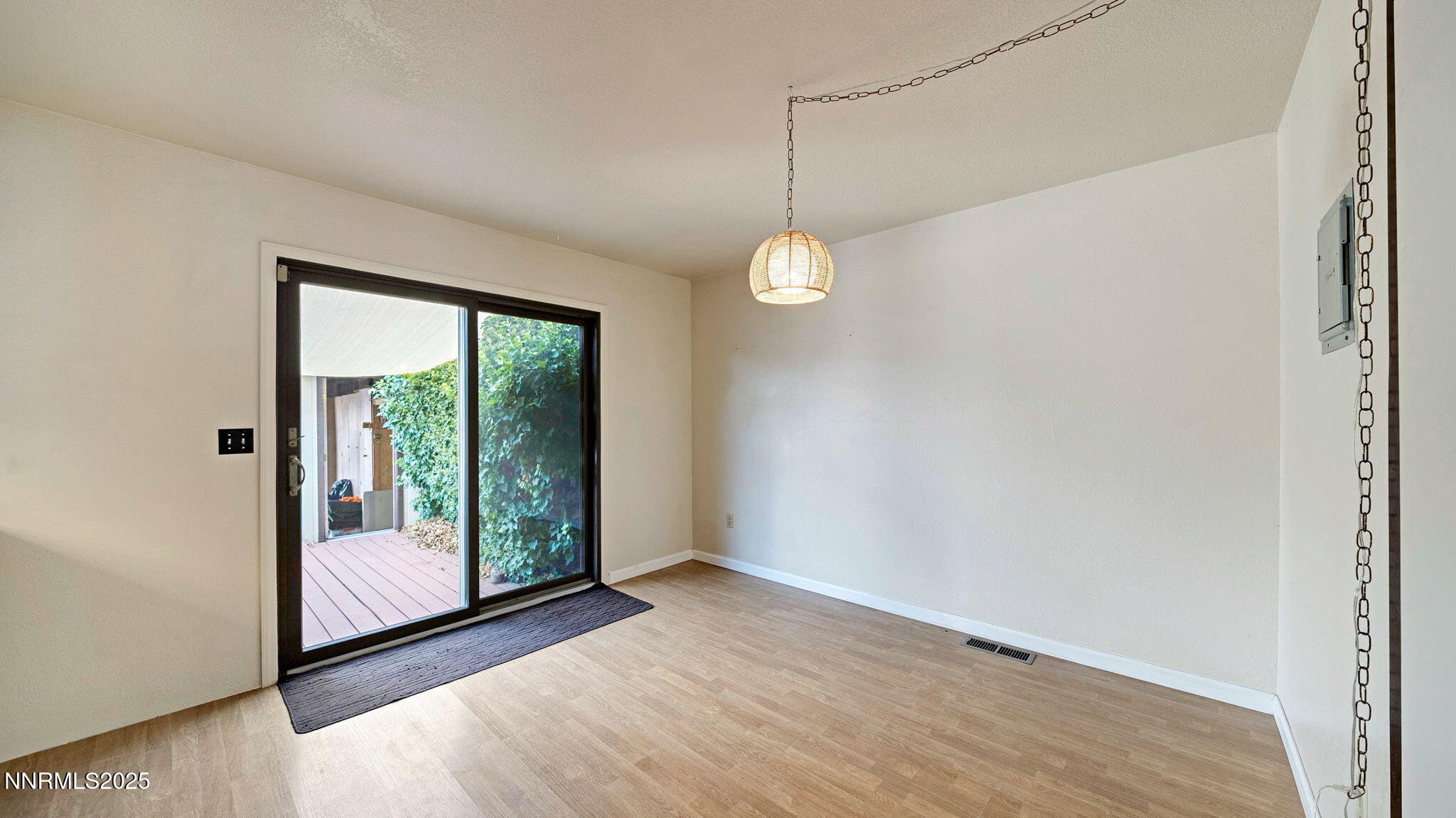 1515 Foster Drive Reno, NV 89509 - Photo 33 of 50 a view of an empty room with wooden floor and a window