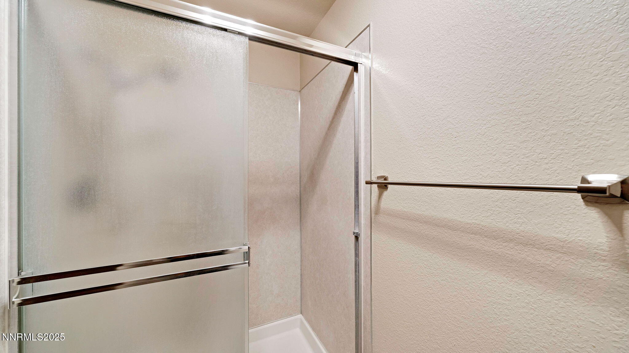 1515 Foster Drive Reno, NV 89509 - Photo 45 of 50 a bathroom with a glass shower door