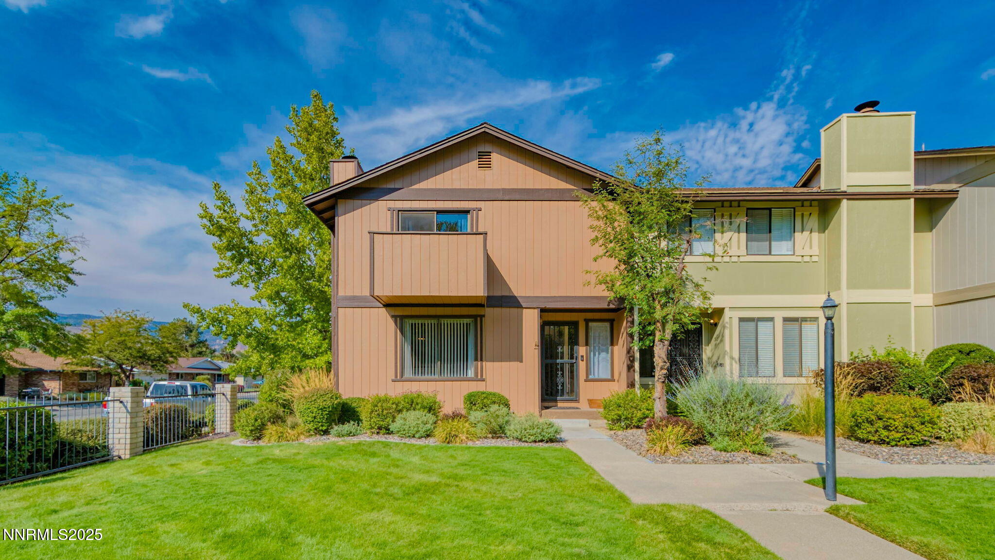 1515 Foster Drive Reno, NV 89509 - Photo 8 of 50 a front view of a house with a yard and garage