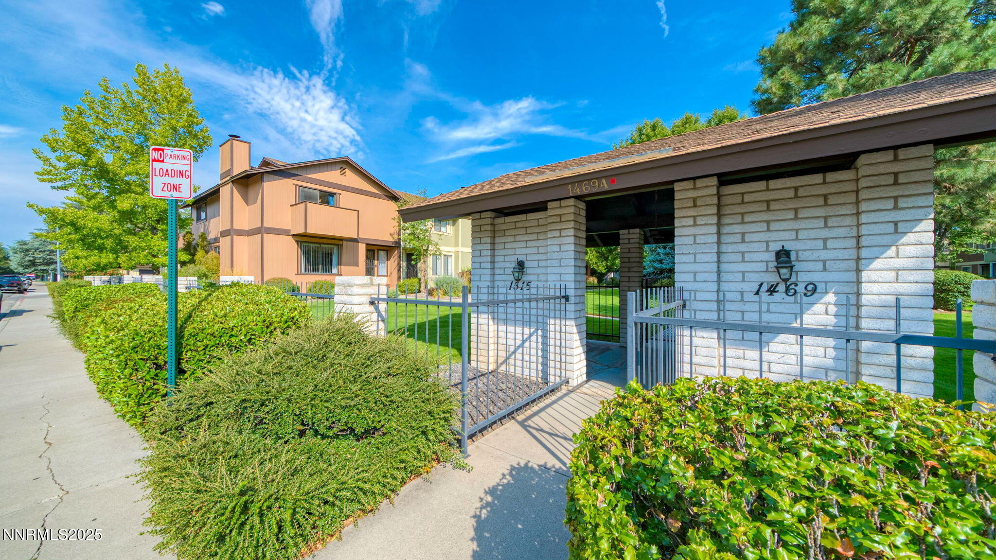 1515 Foster Drive Reno, NV 89509 - Photo 9 of 50 a front view of a house with a yard