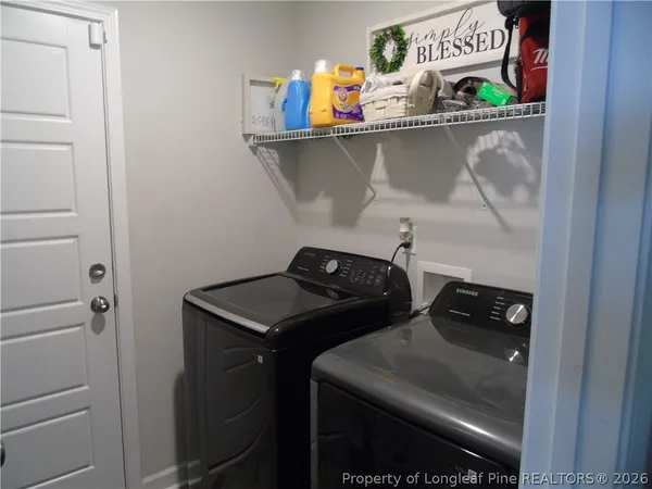 a kitchen with a table and chairs in it