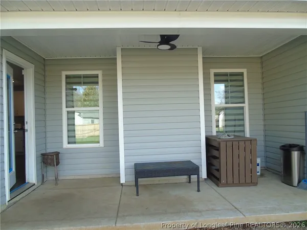 a view of outdoor space with porch and windows