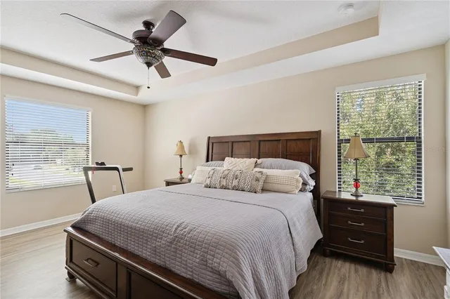 a bedroom with a large bed and a large window