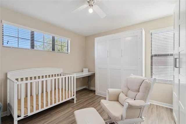 a bedroom with furniture and wooden floor