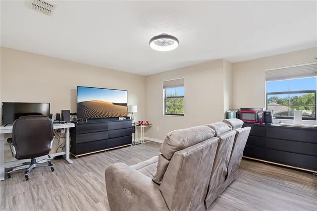 a living room with furniture and a window