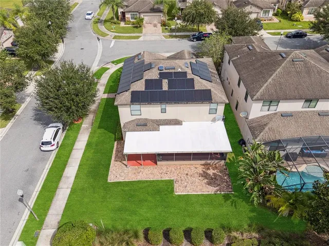an aerial view of a house with a garden