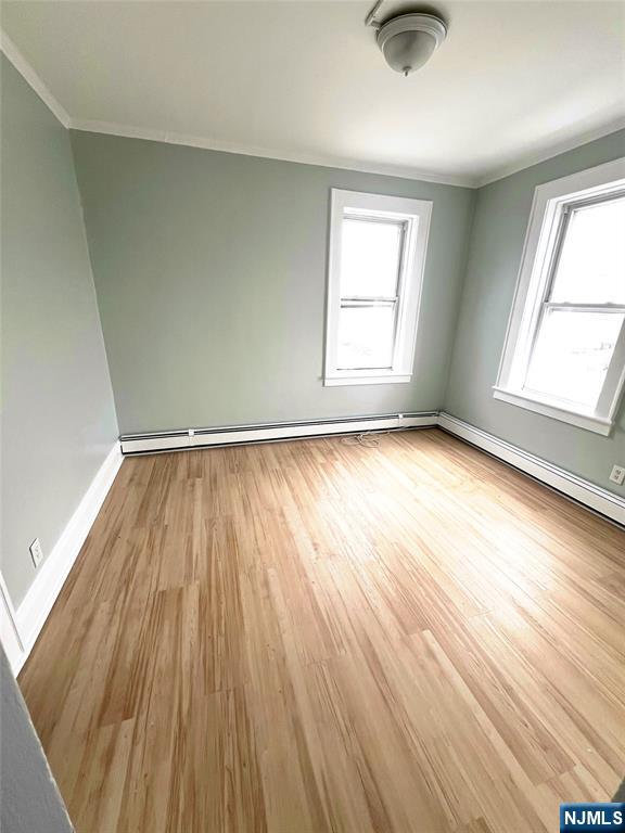 193 President Street, Unit 9 Passaic, NJ 07055 - Photo 3 of 11 wooden floor in an empty room with a window