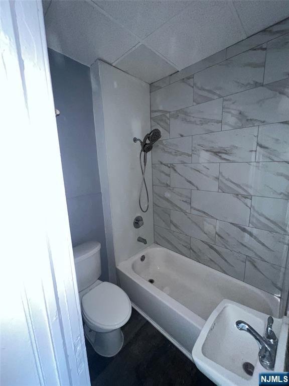 193 President Street, Unit 9 Passaic, NJ 07055 - Photo 6 of 11 a bathroom with a toilet and a tub