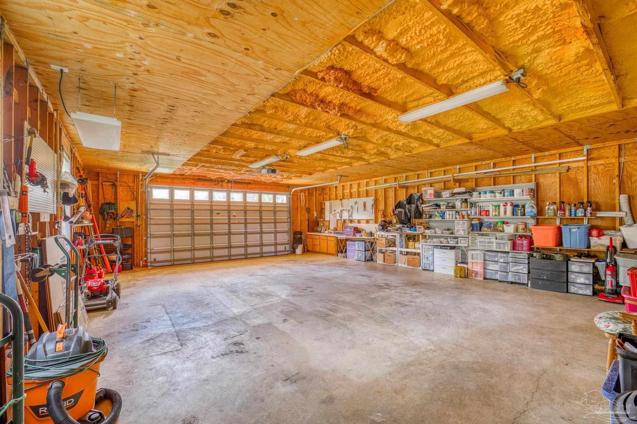5897 Curtis Road Pace, FL 32571 - Photo 36 of 45 inside the 2 car garage area PLUS storage space