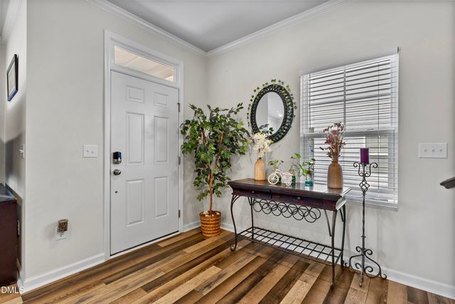a view of a entryway door with wooden floor