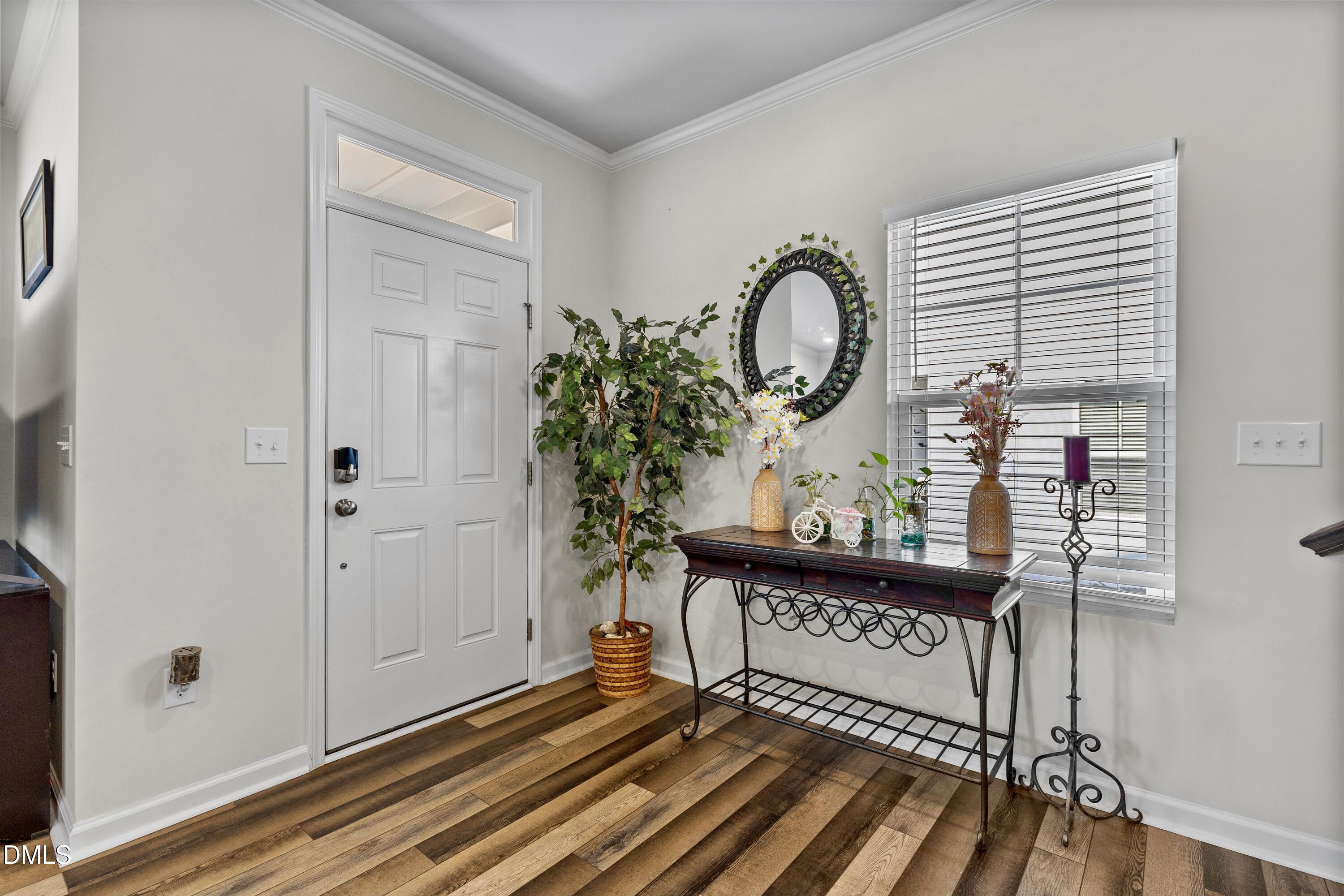 1811 Aspen River Lane Apex, NC 27502 - Photo 11 of 53 a view of a entryway door with wooden floor