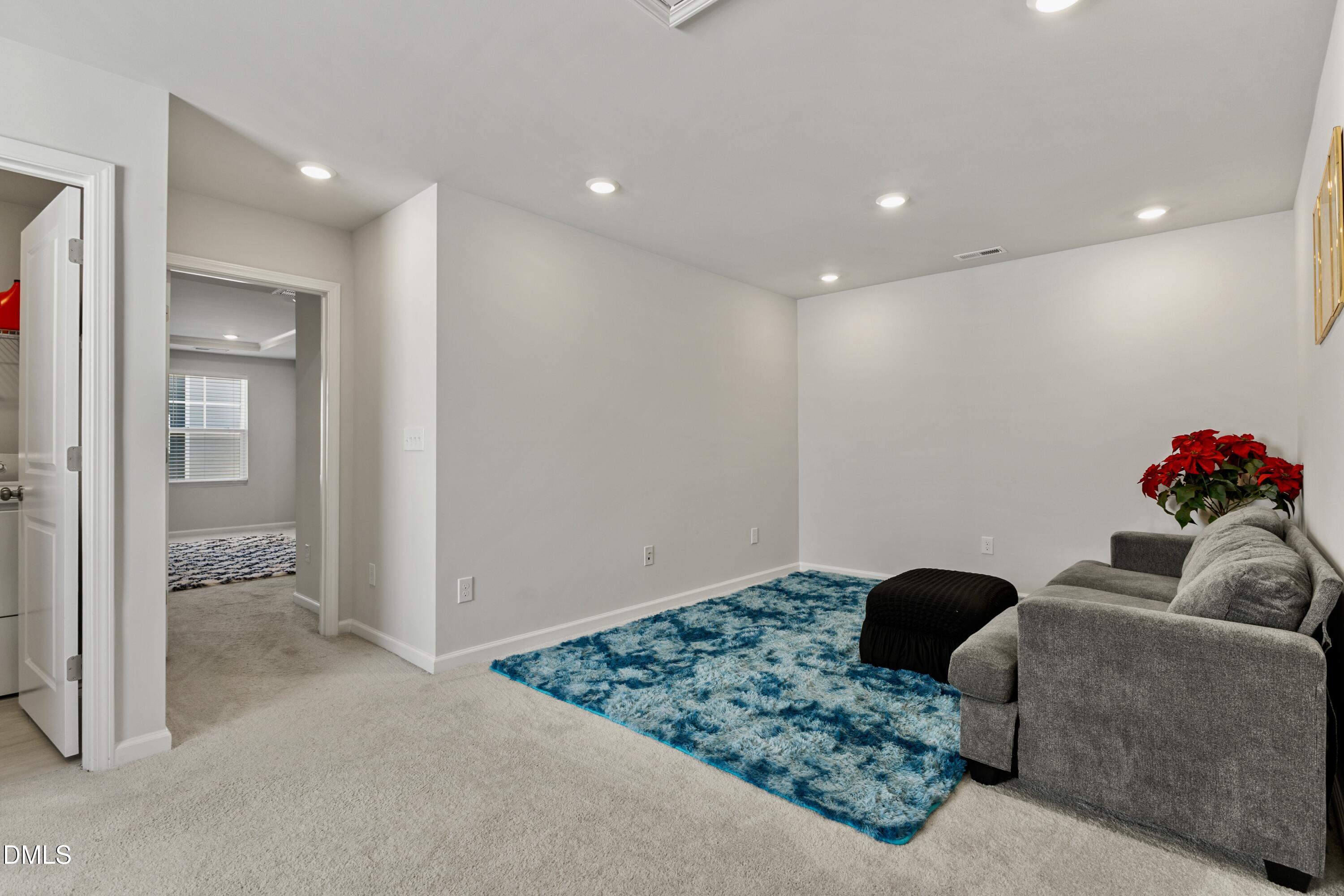 1811 Aspen River Lane Apex, NC 27502 - Photo 23 of 53 a living room with furniture and a view of bathroom