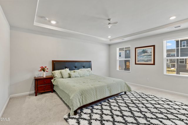 a bedroom with a bed and cabinets