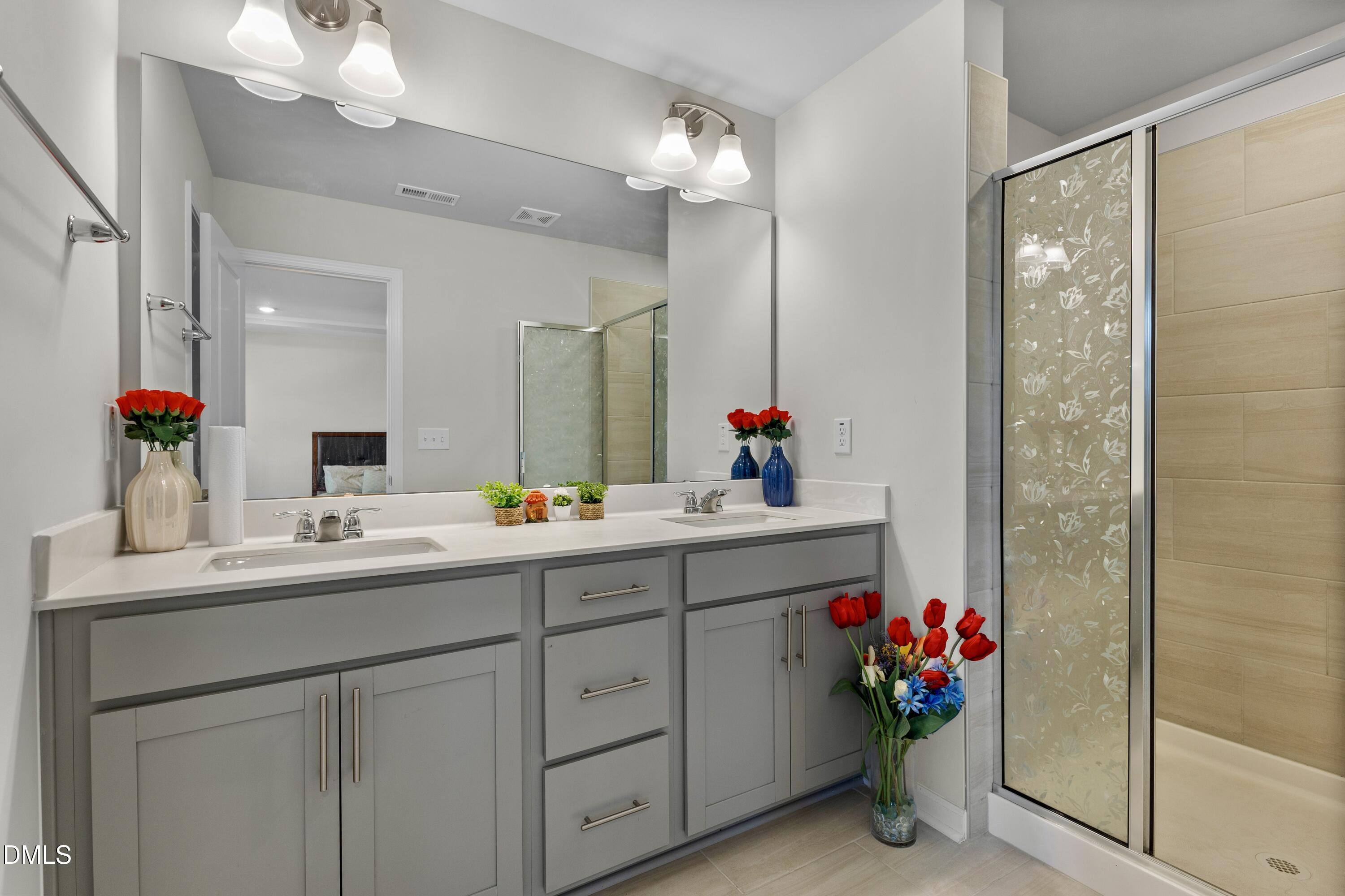 1811 Aspen River Lane Apex, NC 27502 - Photo 26 of 53 a bathroom with a sink vanity and mirror