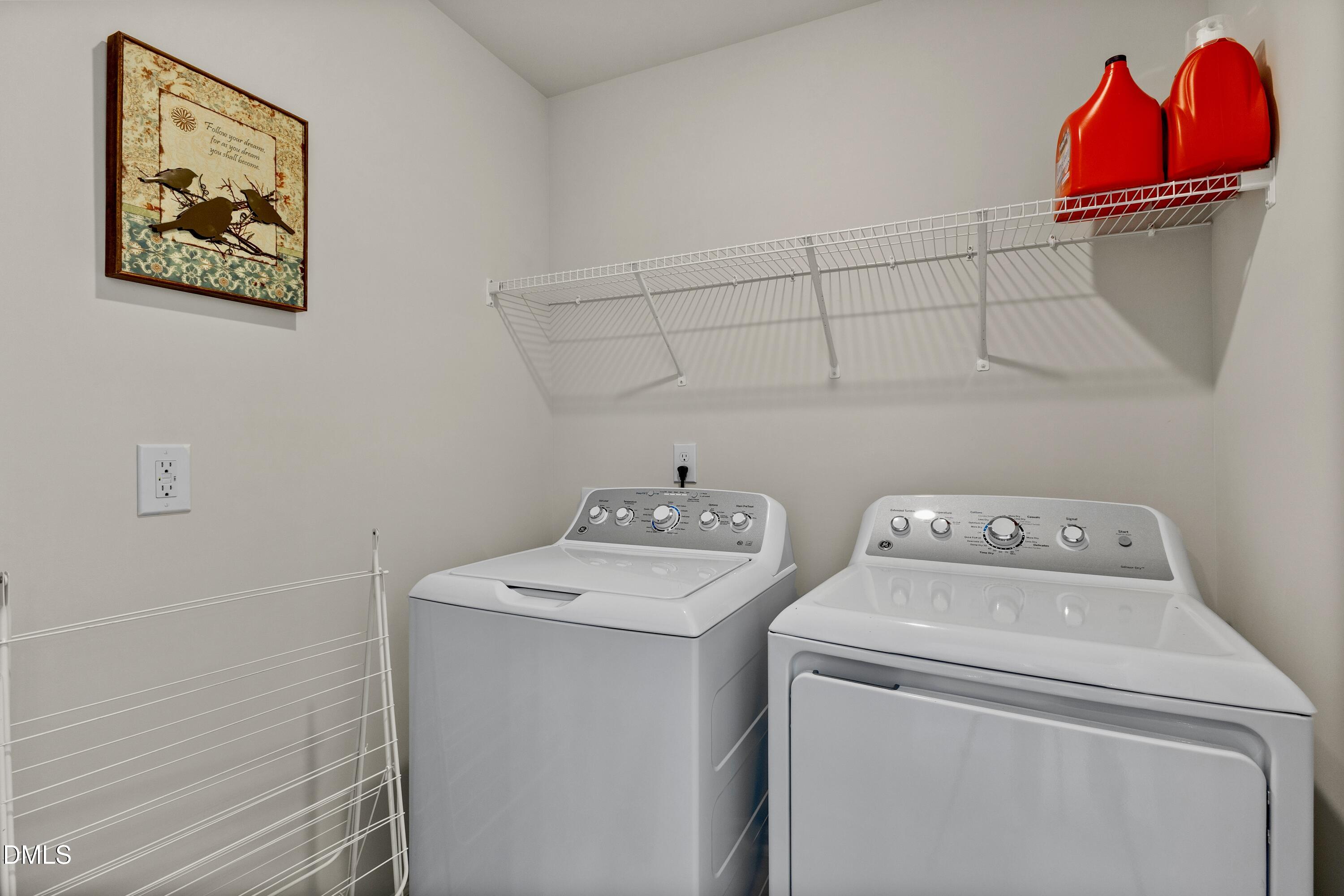 1811 Aspen River Lane Apex, NC 27502 - Photo 31 of 53 a utility room with dryer and washer
