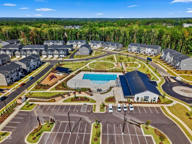 a view of swimming pool with seating area and hardwood floor