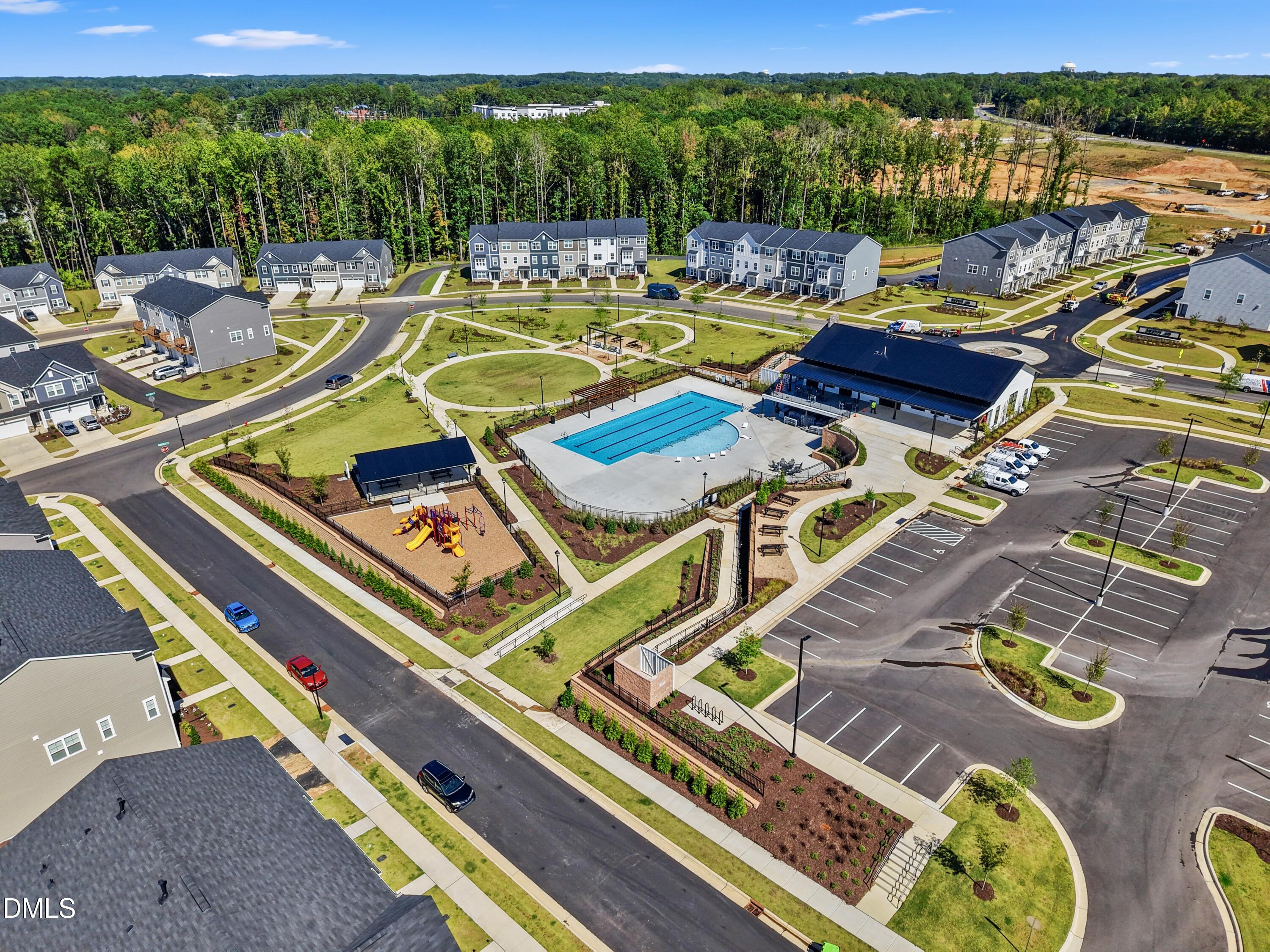 1811 Aspen River Lane Apex, NC 27502 - Photo 36 of 53 a view of swimming pool with seating area and hardwood floor