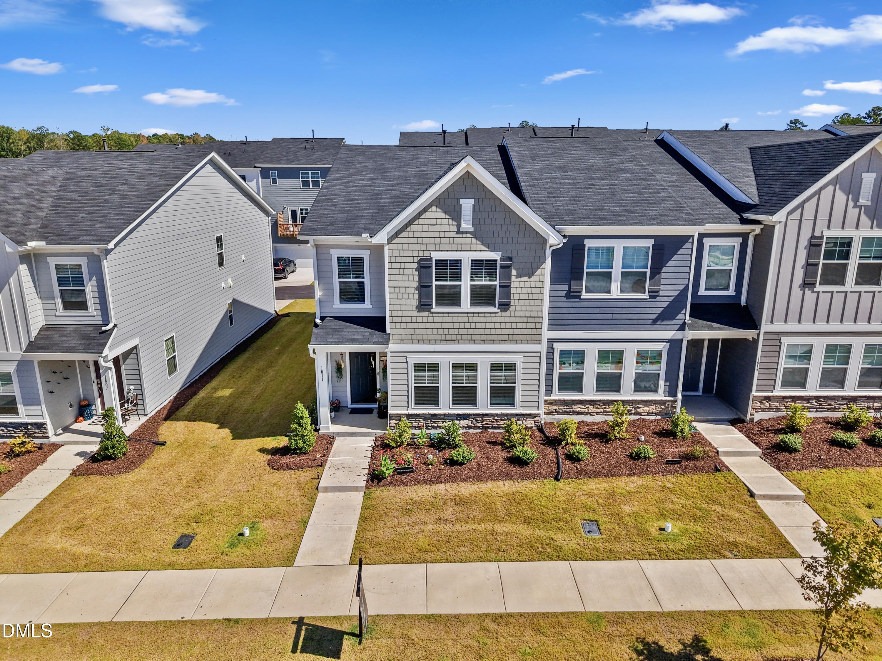 1811 Aspen River Lane Apex, NC 27502 - Photo 4 of 53 a view of a white house with a large pool