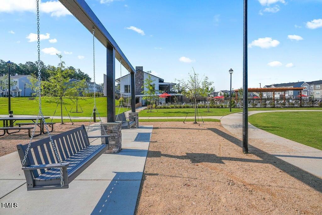 1811 Aspen River Lane Apex, NC 27502 - Photo 41 of 53 a view of a swimming pool with a patio and a yard