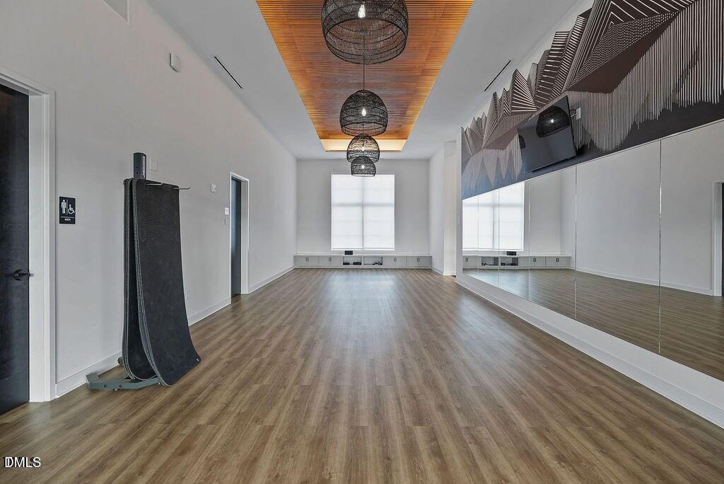 1811 Aspen River Lane Apex, NC 27502 - Photo 44 of 53 a view of a room with wooden floor