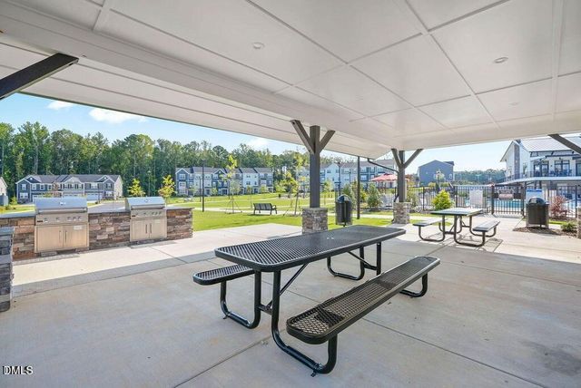 an aerial view of a house with garden space lake view and mountain view in back